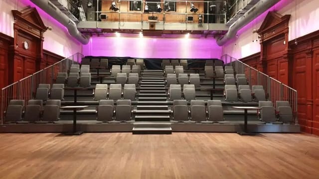 Grote Zaal in De Balie: tiered seating for presentations and performances, modern event space.
