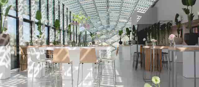 Modern event space with glass ceiling, ideal for networking and receptions.