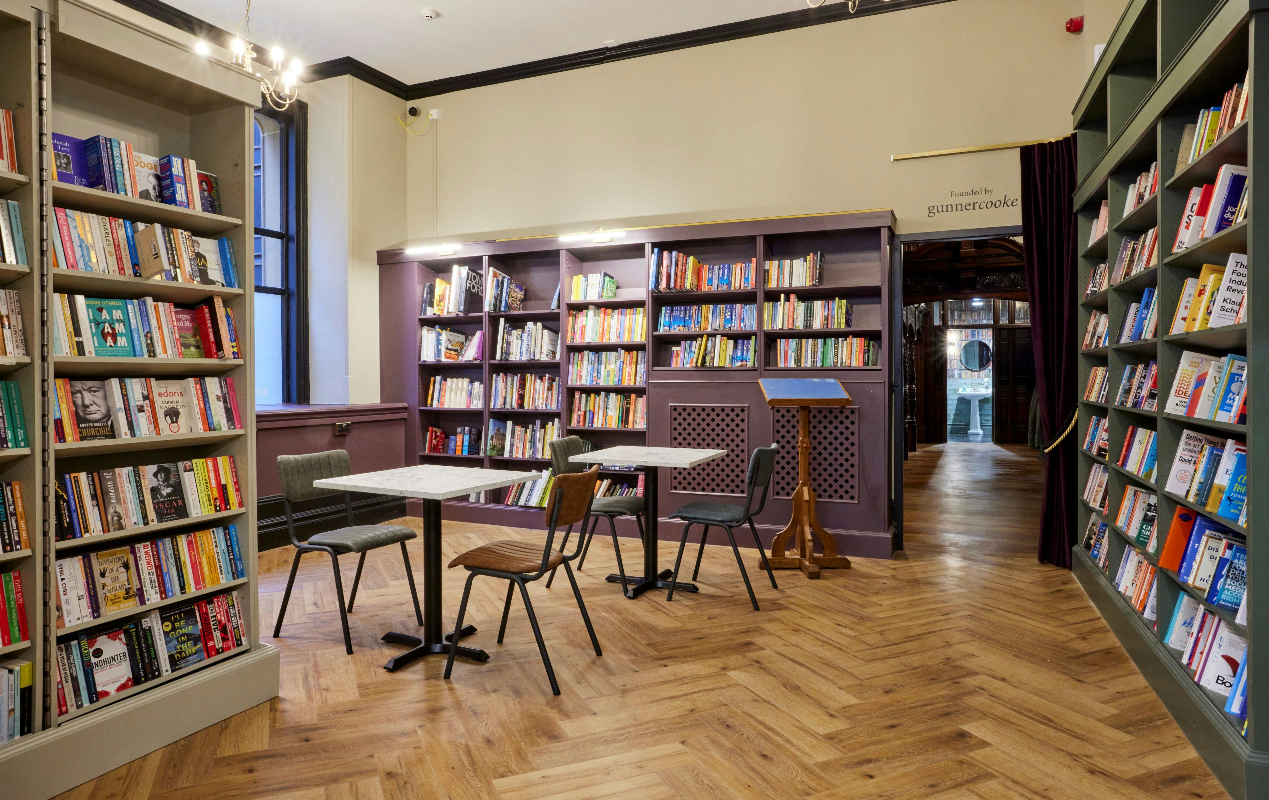 Cozy Gladstone Room with bookshelves, ideal for workshops and book clubs.