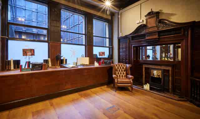 Gladstone Room: elegant wooden event space with natural light for meetings and networking.