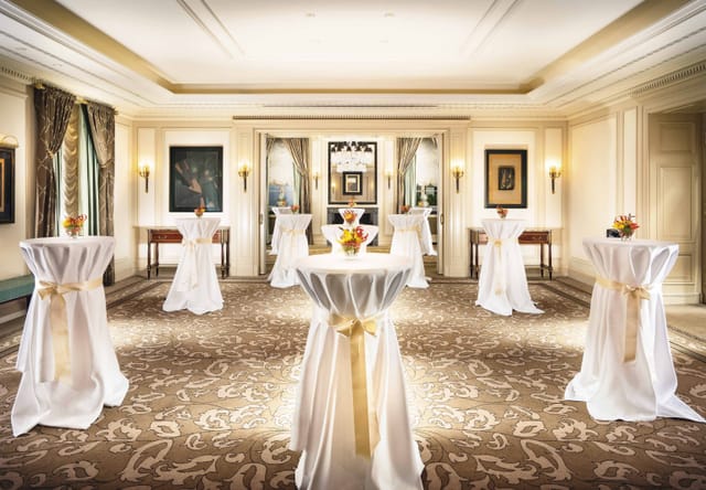 Elegant reception setup at Le Petit Palais with floral centerpieces and soft lighting.