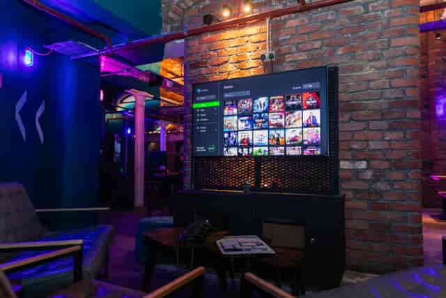 Modern event space with large screen, ideal for networking and presentations.