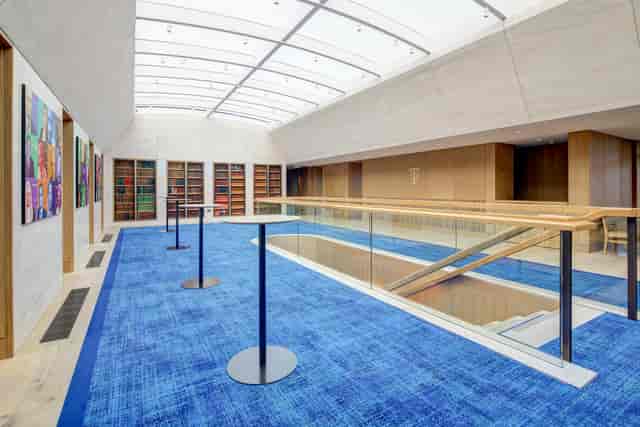 Modern event space with large windows and blue carpet at The Inner Temple.