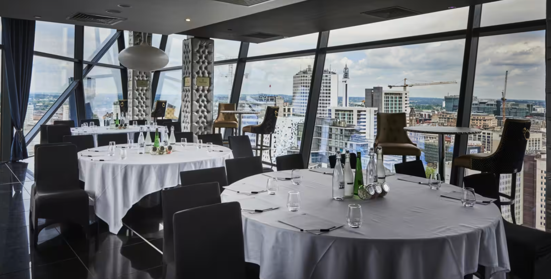 Elegant event space in The Cube Hotel with skyline views, perfect for corporate gatherings.