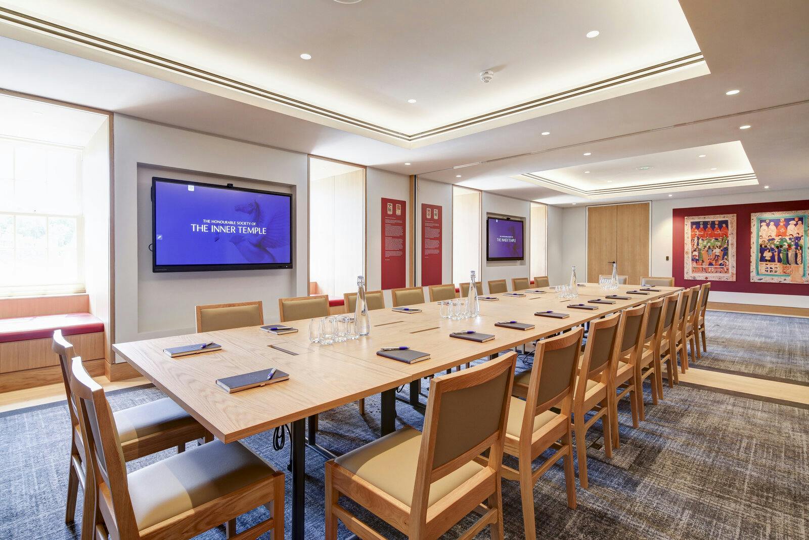 Meeting room with long table and dual screens for professional gatherings in The Inner Temple.