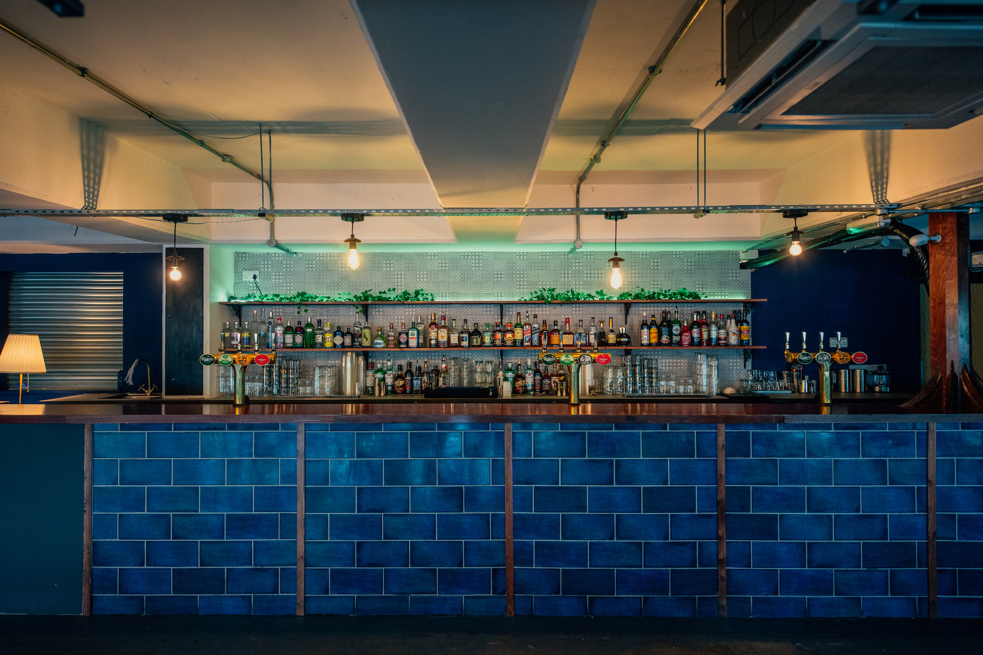 Stylish bar at The Gig Space, Peckham Levels, ideal for networking events and social gatherings. - Banner