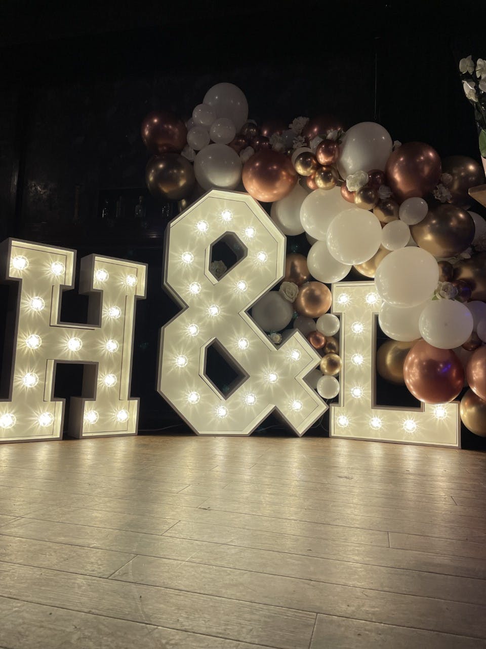 Illuminated "H & L" marquee at The Fitzgerald, perfect for weddings and celebrations.