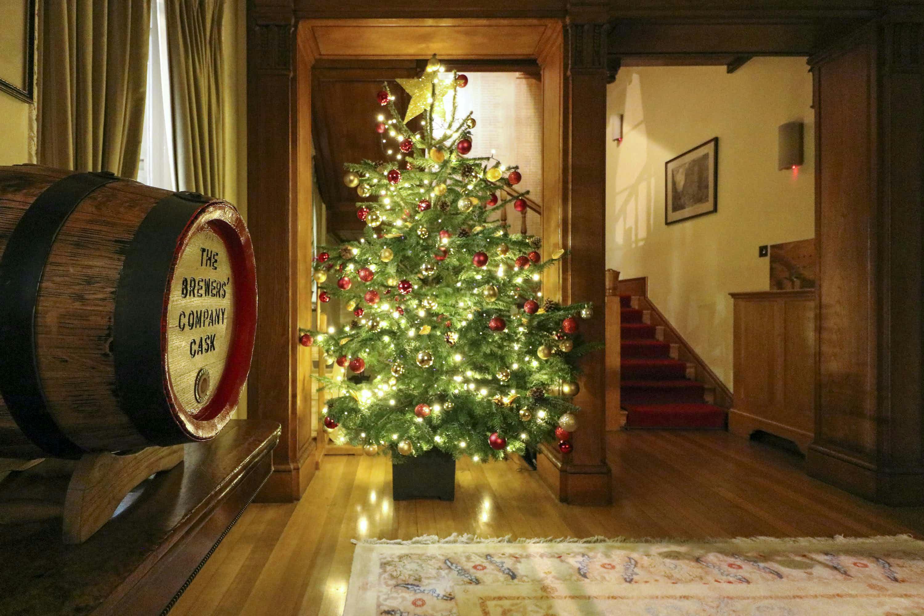 Christmas tree with red ornaments at Brewers' Hall, perfect for festive gatherings.