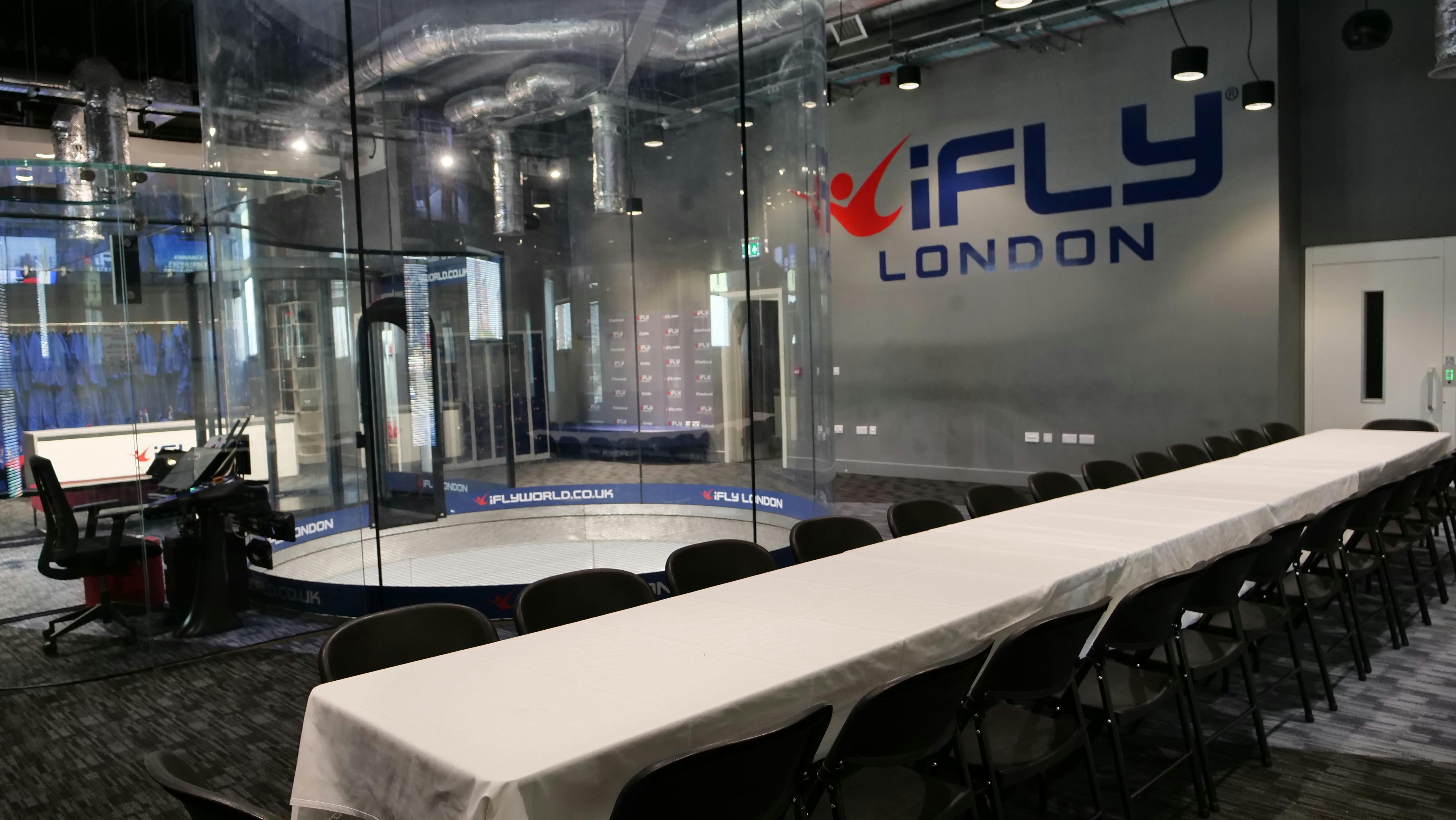 iFLY Indoor Skydiving Flight Deck with glass wind tunnel for corporate events and team-building.