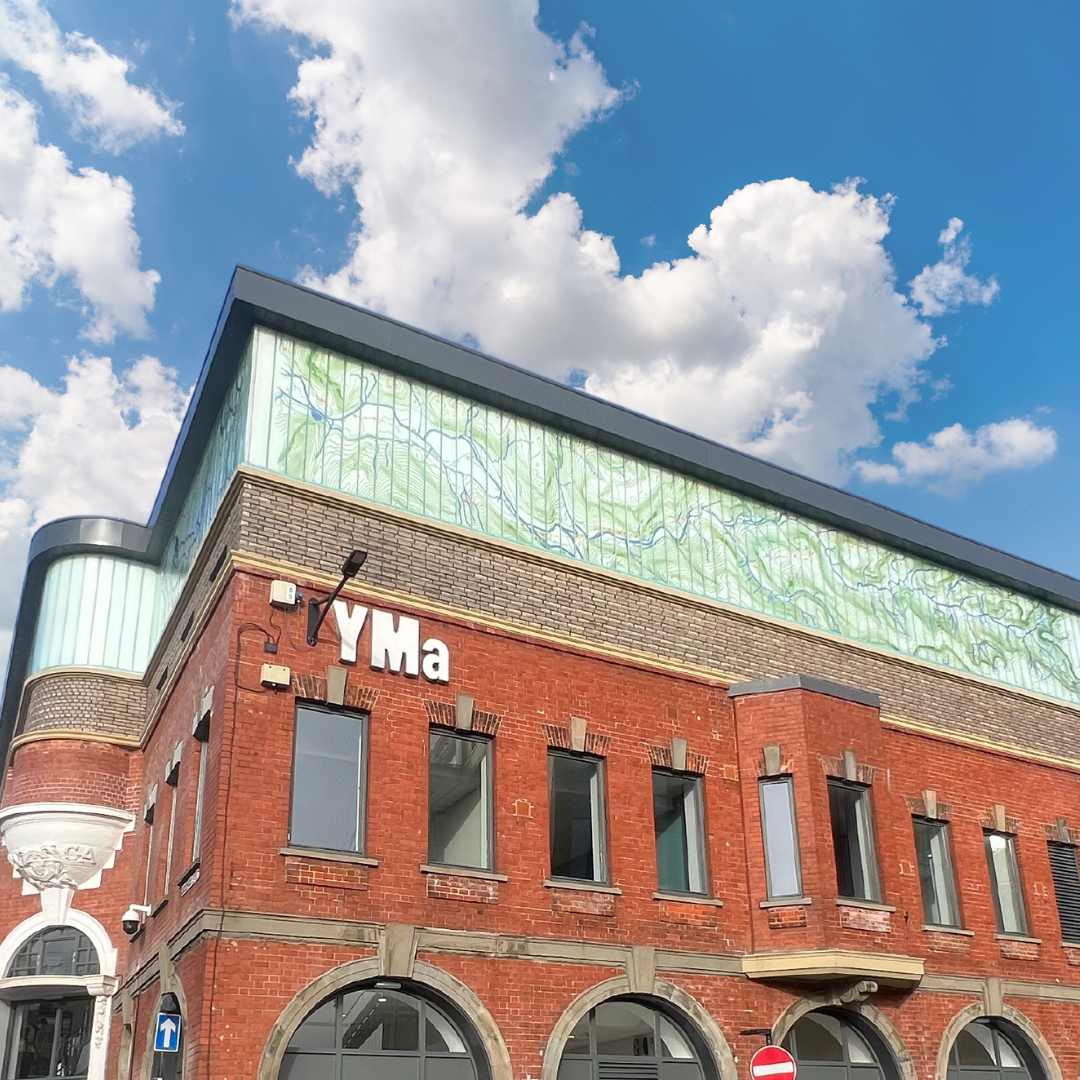 Modern venue with striking brick and glass design, perfect for corporate events and workshops. - Banner