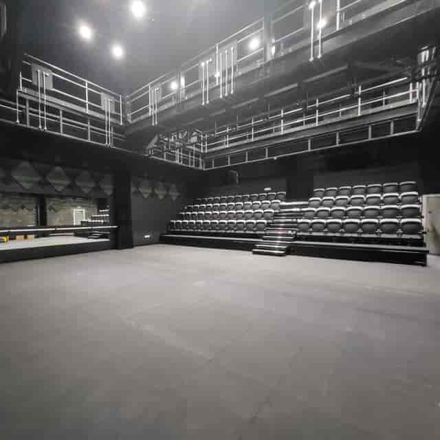 Versatile event space with tiered seating for presentations and performances in Pontypridd.