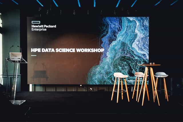 Modern stage setup for HPE Data Science Workshop at La Compagnie 1837, featuring sleek design.