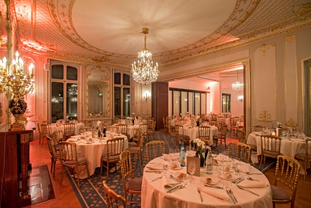Elegant banquet hall with crystal chandelier, perfect for weddings and corporate events.