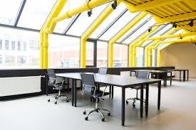 Modern urban hotel meeting space with sleek tables, ideal for workshops and team meetings.