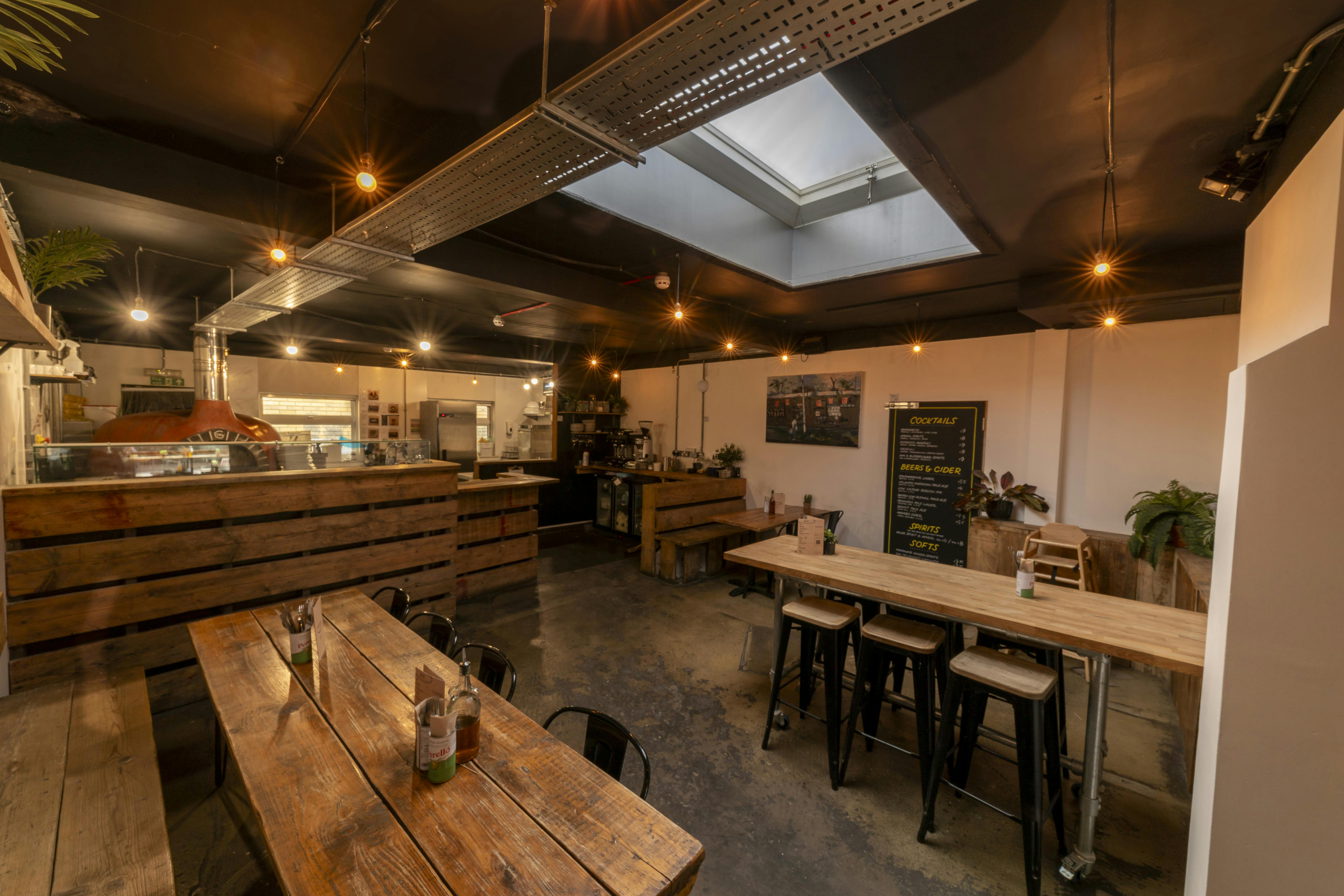 Versatile event space in Mamma Dough Peckham, ideal for workshops and networking.