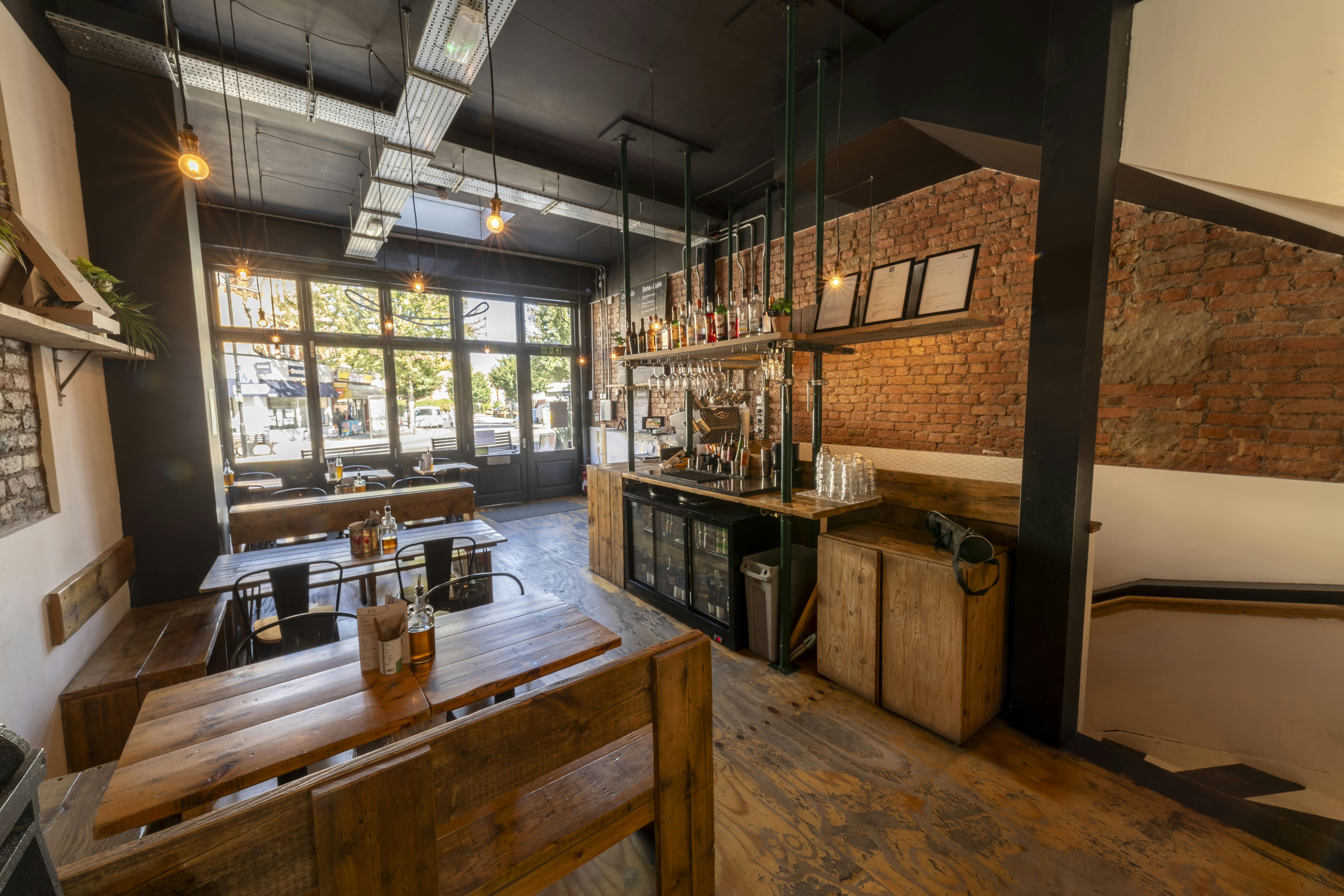 Stylish industrial venue with exposed brick, perfect for meetings and networking events.