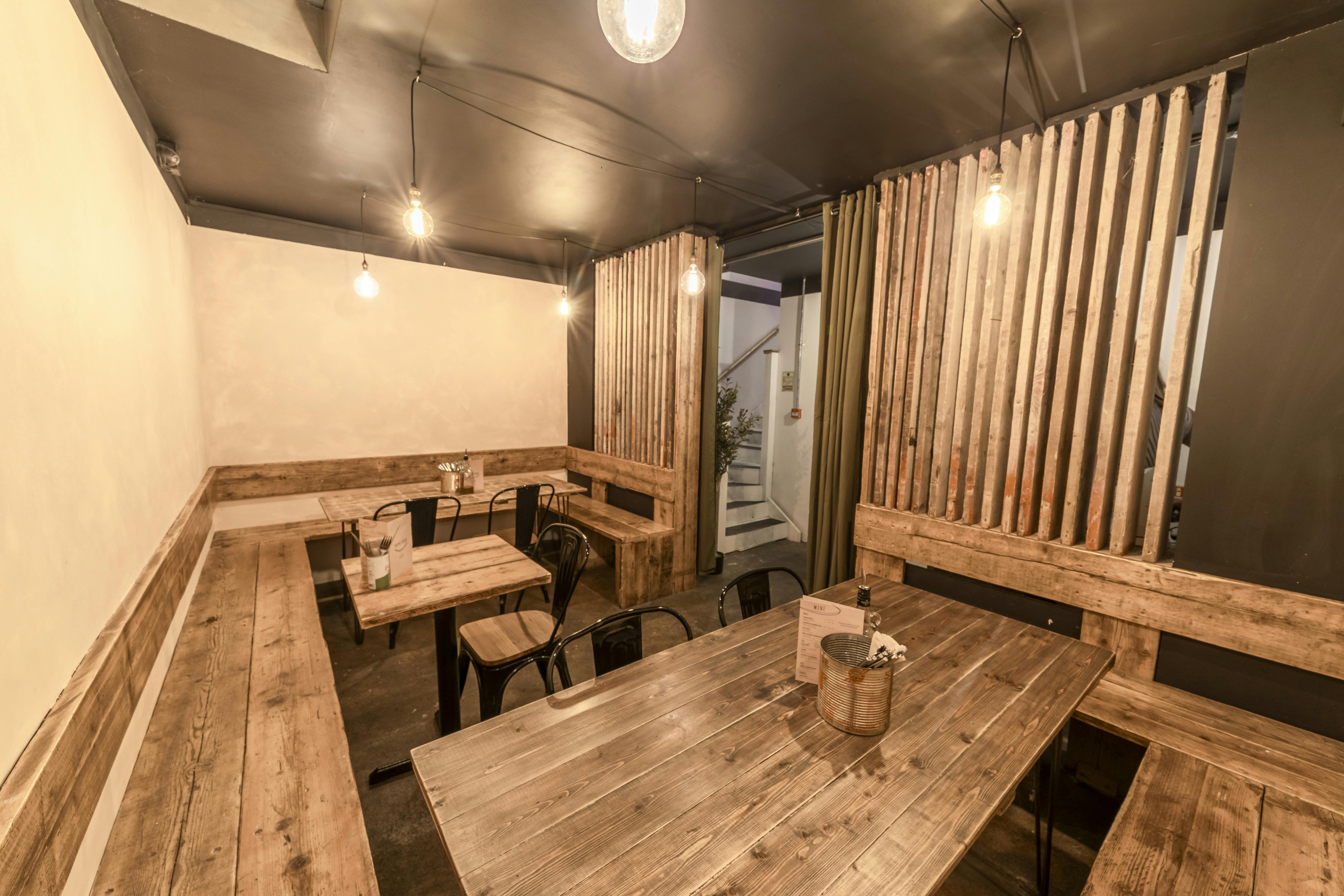 Cozy rustic meeting space at Mamma Dough Ladywell, perfect for workshops and discussions.