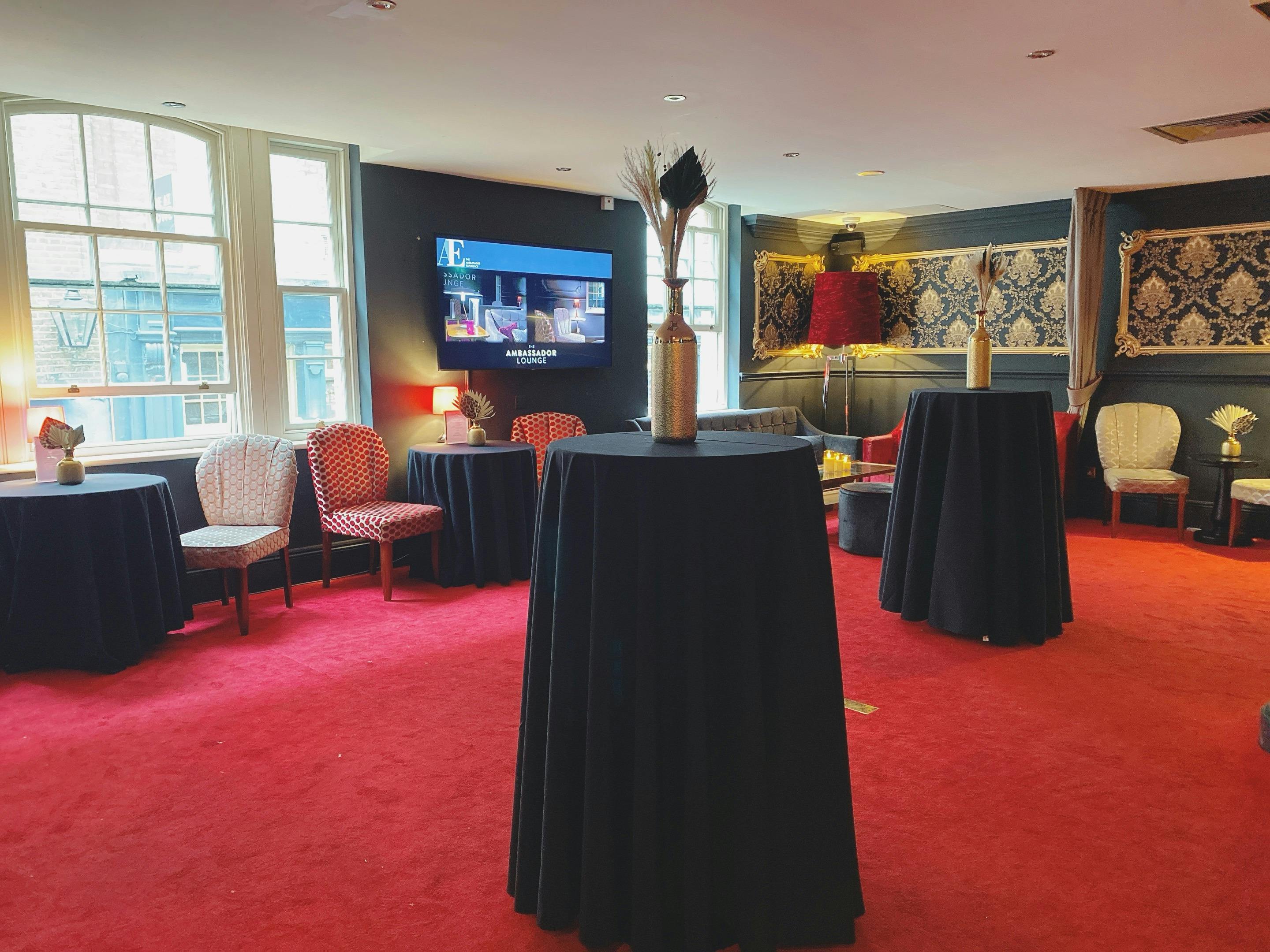 Ambassadors Lounge in ATG VIP: elegant event space with high-top tables for networking events.