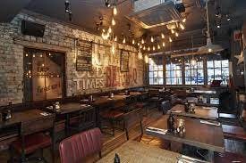 Rustic restaurant venue with exposed brick, ideal for casual meetings and intimate celebrations.