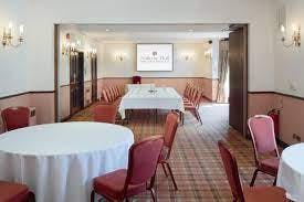 Corporate event space at Nailcote Hall with round tables for meetings and workshops.