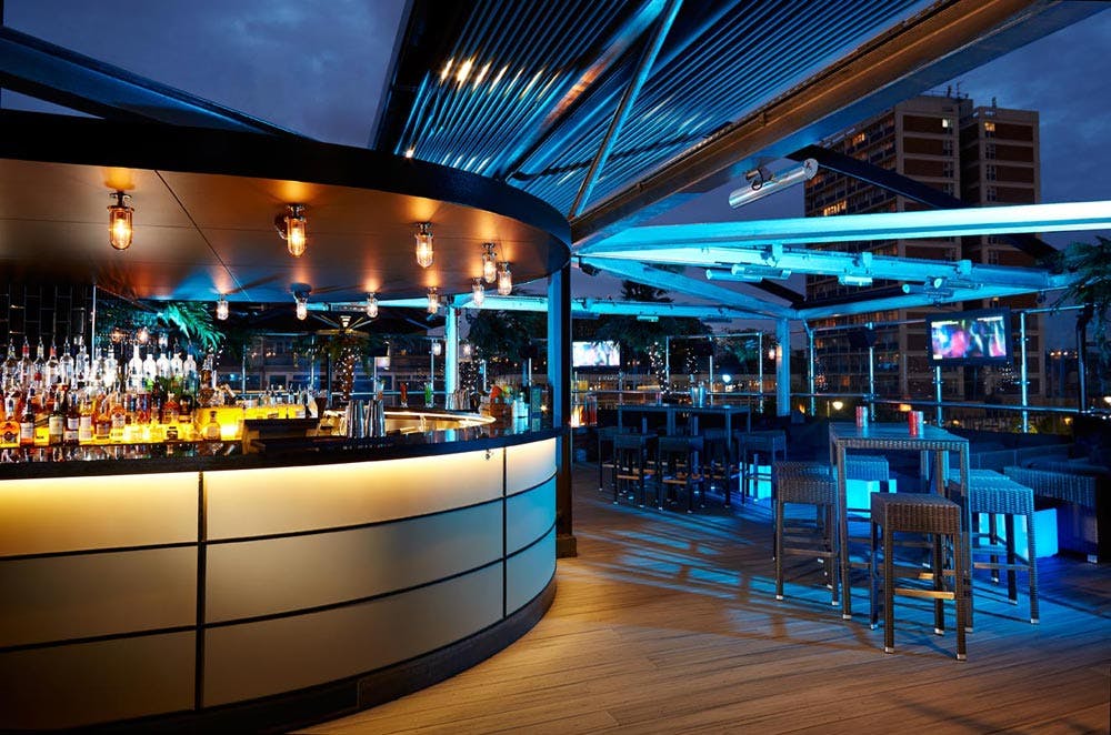 Stylish rooftop bar at Private Venue in Golden Bee, perfect for upscale events and gatherings.