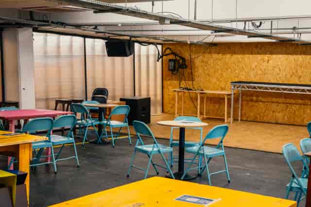 Versatile event space in Peckham Levels with colorful seating for workshops and gatherings.