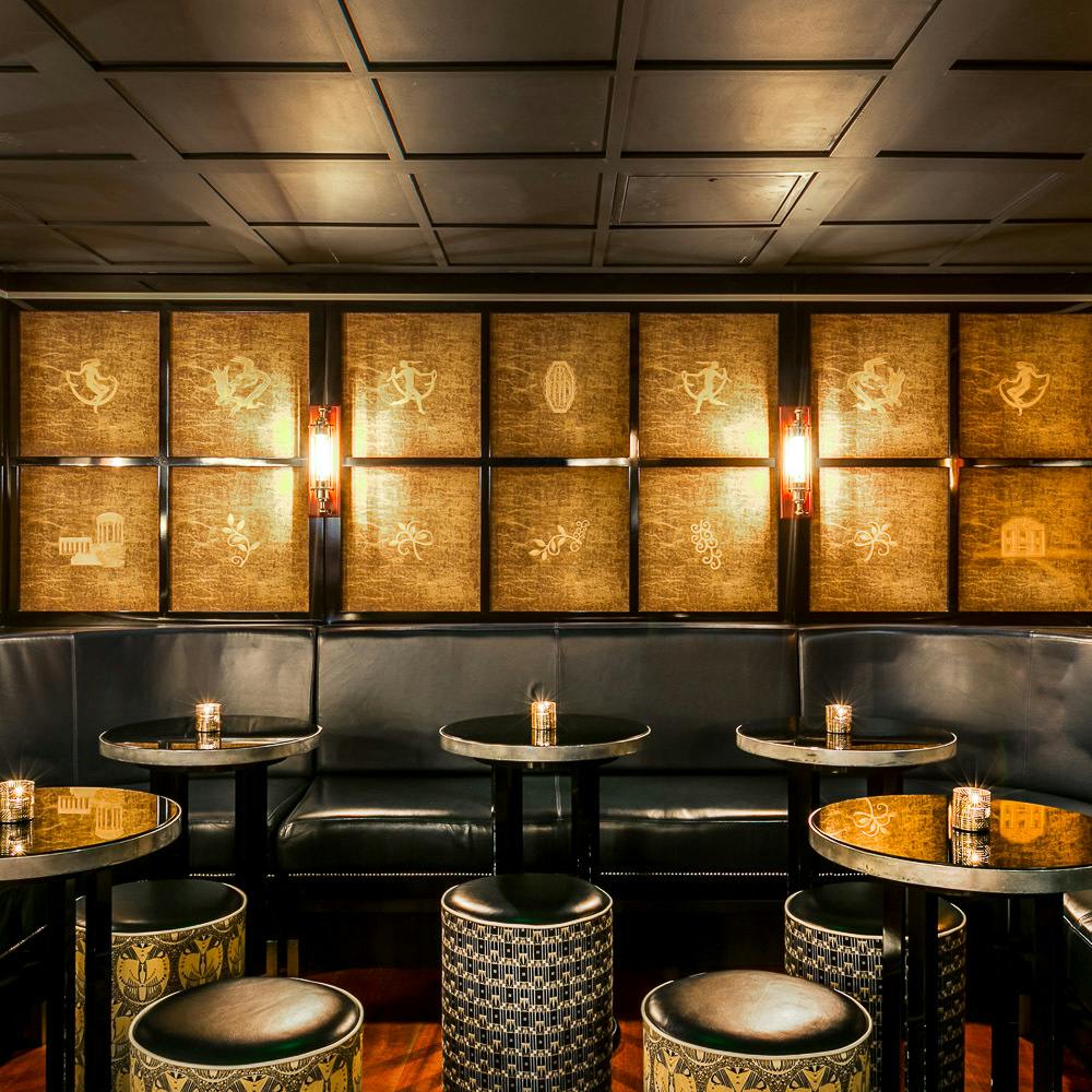 Stylish lounge in Swift Soho with warm lighting for intimate meetings and networking events.