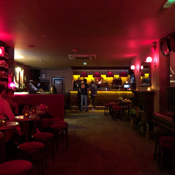 Cozy dimly lit bar at The Arts Theatre Club, perfect for intimate gatherings and networking.