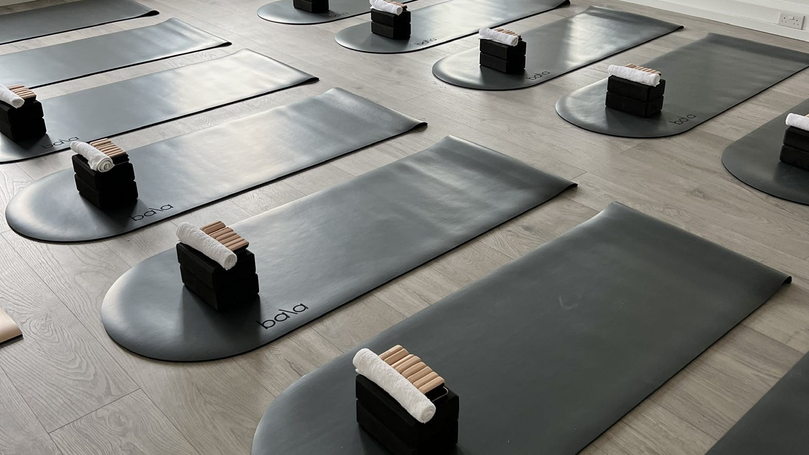Well-organized yoga studio with mats, ideal for retreats and corporate wellness events.
