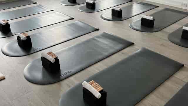 Well-organized yoga studio with mats, ideal for retreats and corporate wellness events.