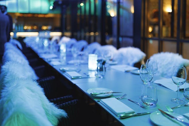 Elegant dining table with fur accents for upscale Christmas parties at Trafalgar St James.