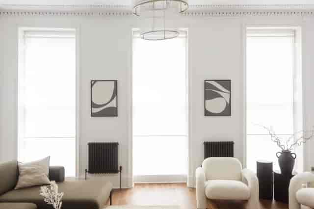 Modern minimalist meeting space with natural light for intimate gatherings and workshops.