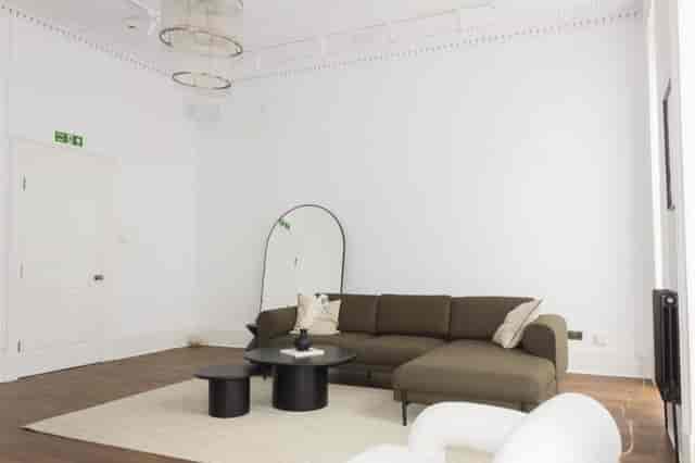 Modern meeting space with sectional sofa, ideal for brainstorming sessions.