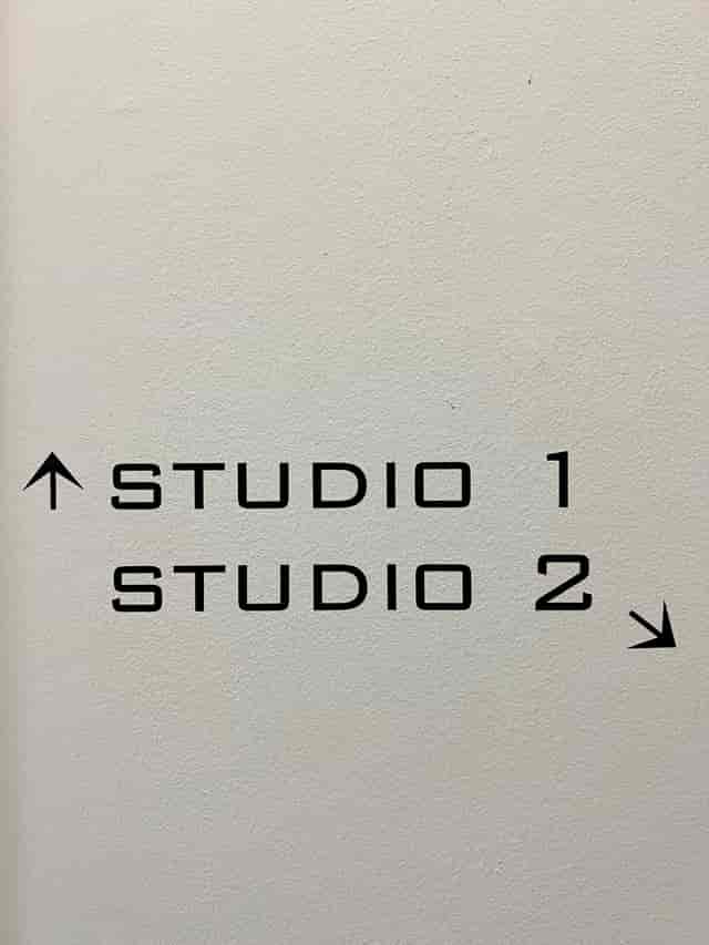 Directional signage in ARC STUDIOS for efficient event navigation between Studio 1 and Studio 2.