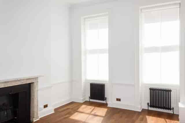 Bright Otto Room in Bloomsbury with fireplace, ideal for corporate meetings or workshops.
