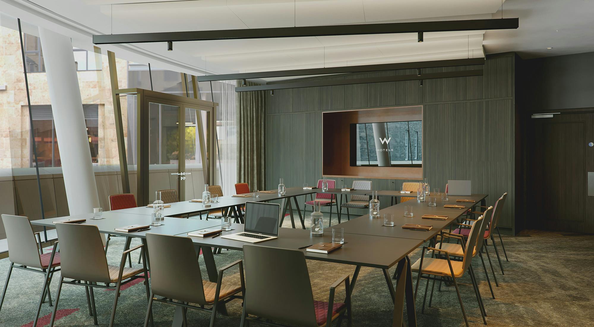 Modern meeting room in W Edinburgh with ergonomic chairs for productive hybrid meetings.