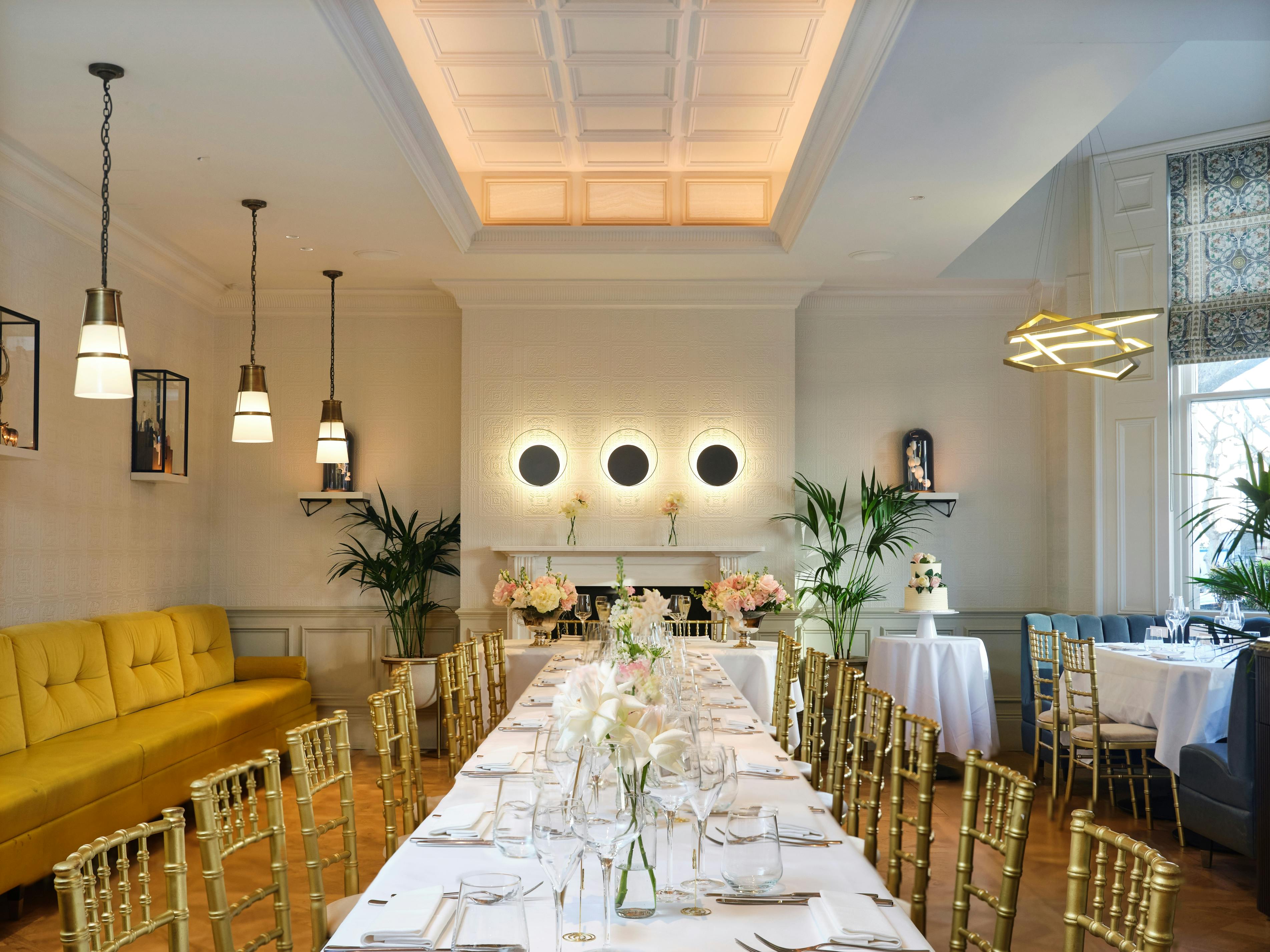 Elegant event space at Cento, 100 Queen's Gate Hotel, ideal for corporate dinners and gatherings.