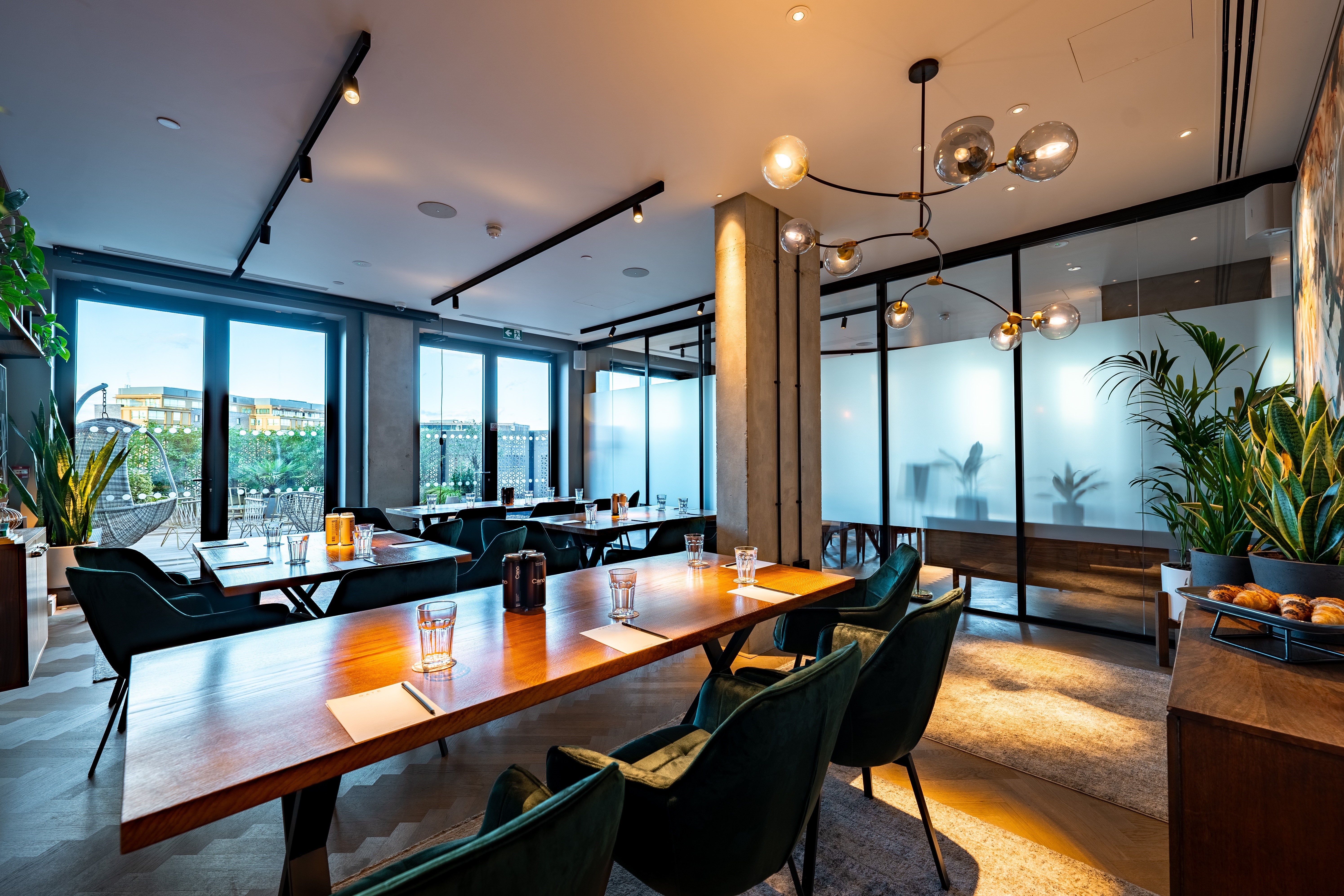 Modern meeting space with large windows at The Gate Aparthotel for corporate events. - Banner
