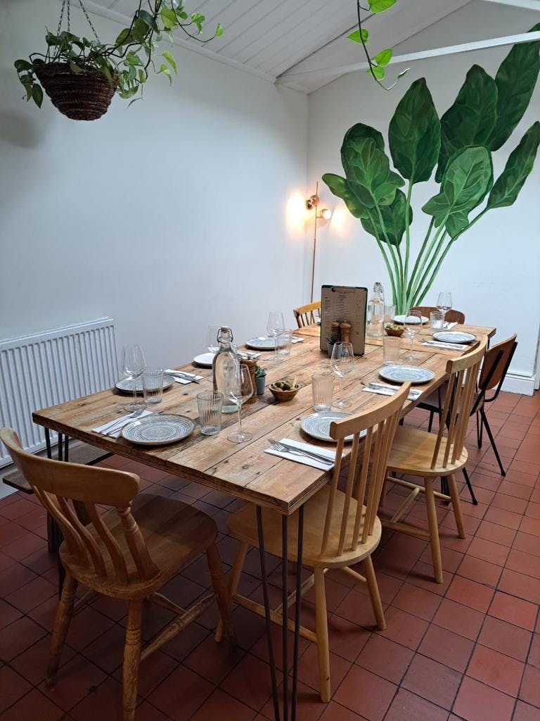 Intimate dining setup with rustic decor at Spinach East Dulwich for networking events.