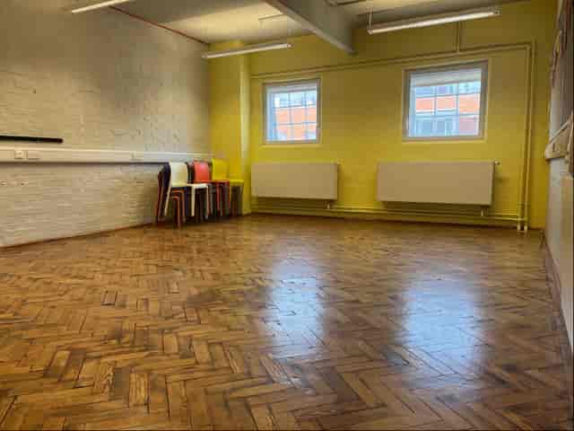 Rehearsal Room 2 at Collective Acting Studio with wooden floor, perfect for workshops.