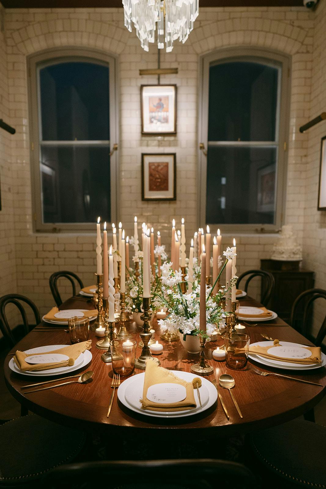 Elegant dining table with candles at Yaatra Restaurant for intimate events.