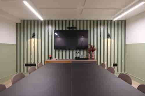 Modern meeting room at Fulwood Place with sleek black table, ideal for collaboration.