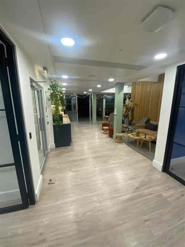 Modern event space with sleek hallway and lounge, perfect for networking and meetings.