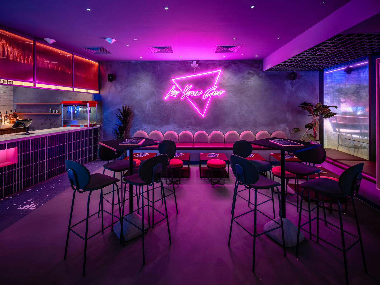 Ground Floor Bar at Canary Wharf: vibrant event space with neon lighting for networking.