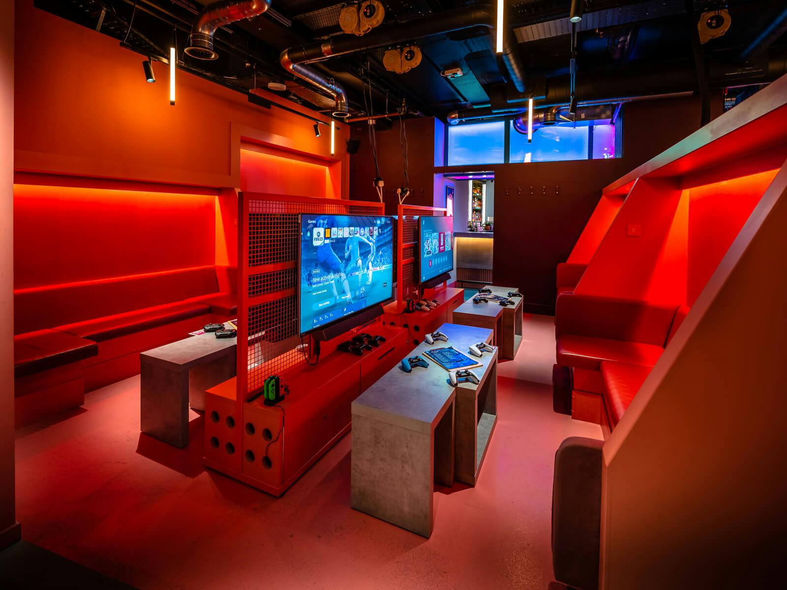 Pink Gaming Lounge at Canary Wharf, featuring bold red decor for esports events and networking.