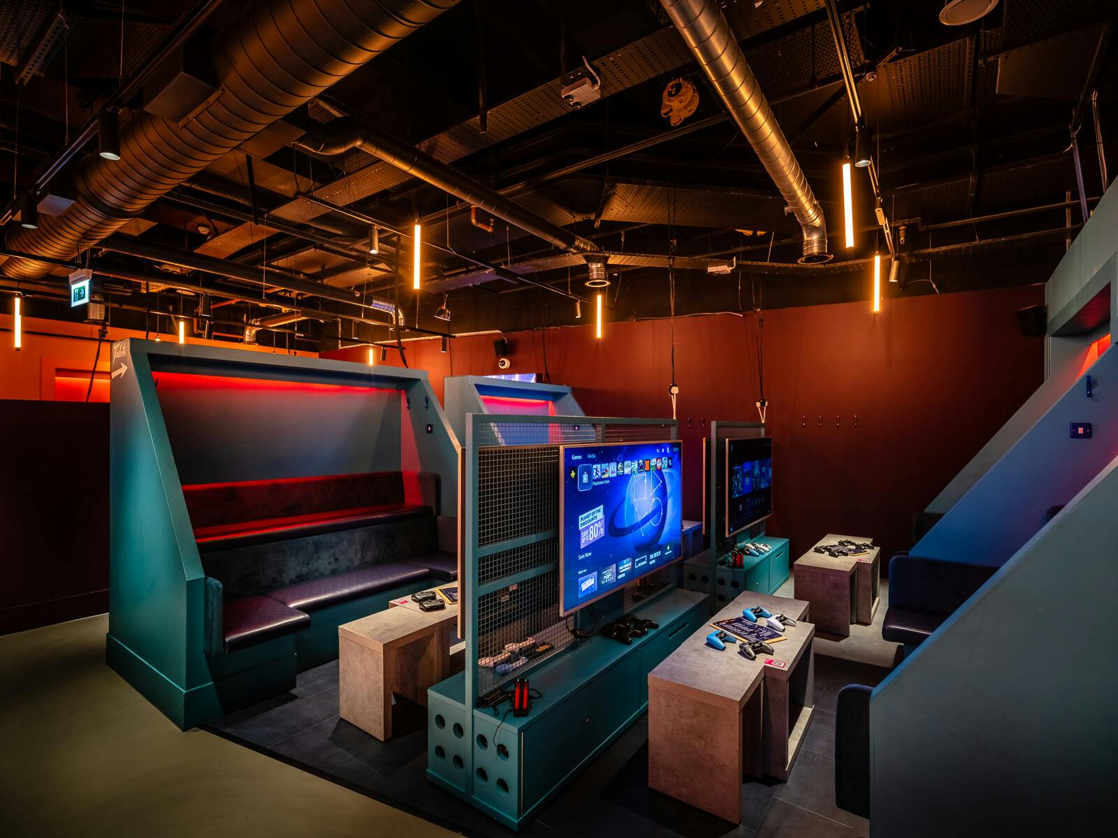 Blue Gaming Lounge at Canary Wharf: modern meeting space with sleek booths for interactive events.