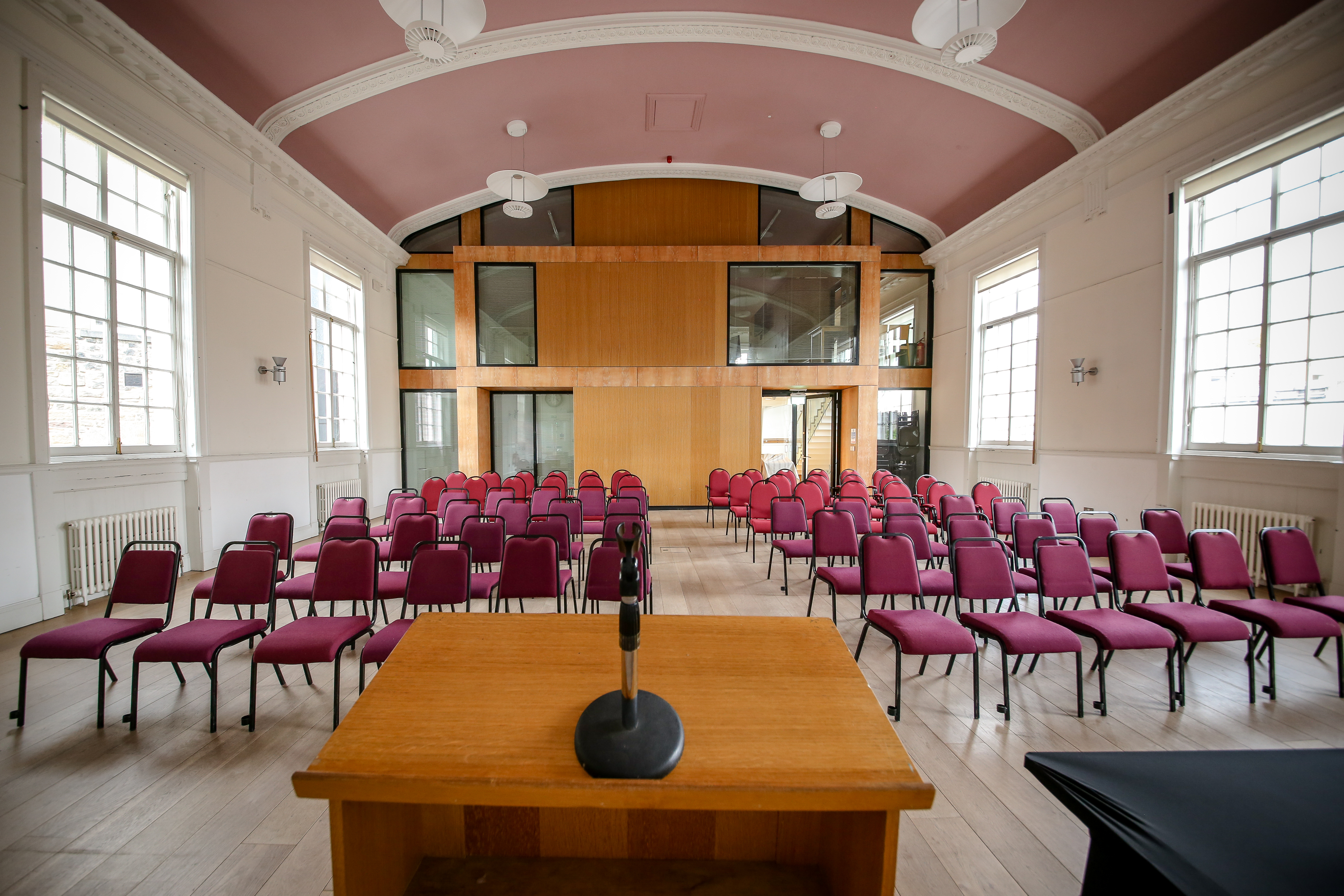 Meeting room in Nicolson Square, Edinburgh with maroon chairs for events and workshops.