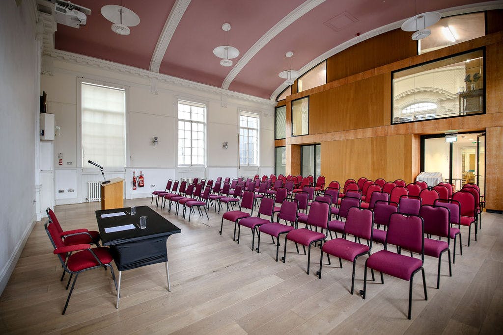 Meeting space in Nicolson Square, Edinburgh with red chairs for presentations and workshops.