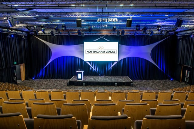Conference Theatre with tiered seating, ideal for corporate events and presentations.