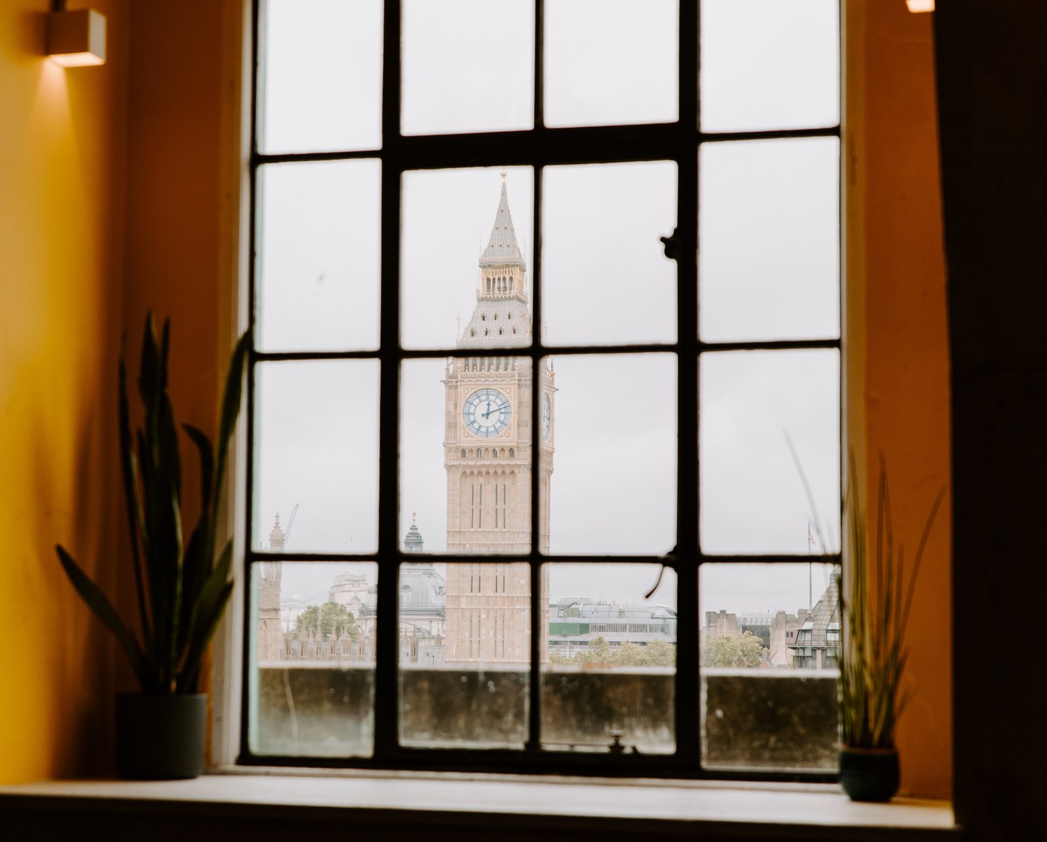 Big Ben view through industrial window, perfect for corporate events and gatherings. - Banner